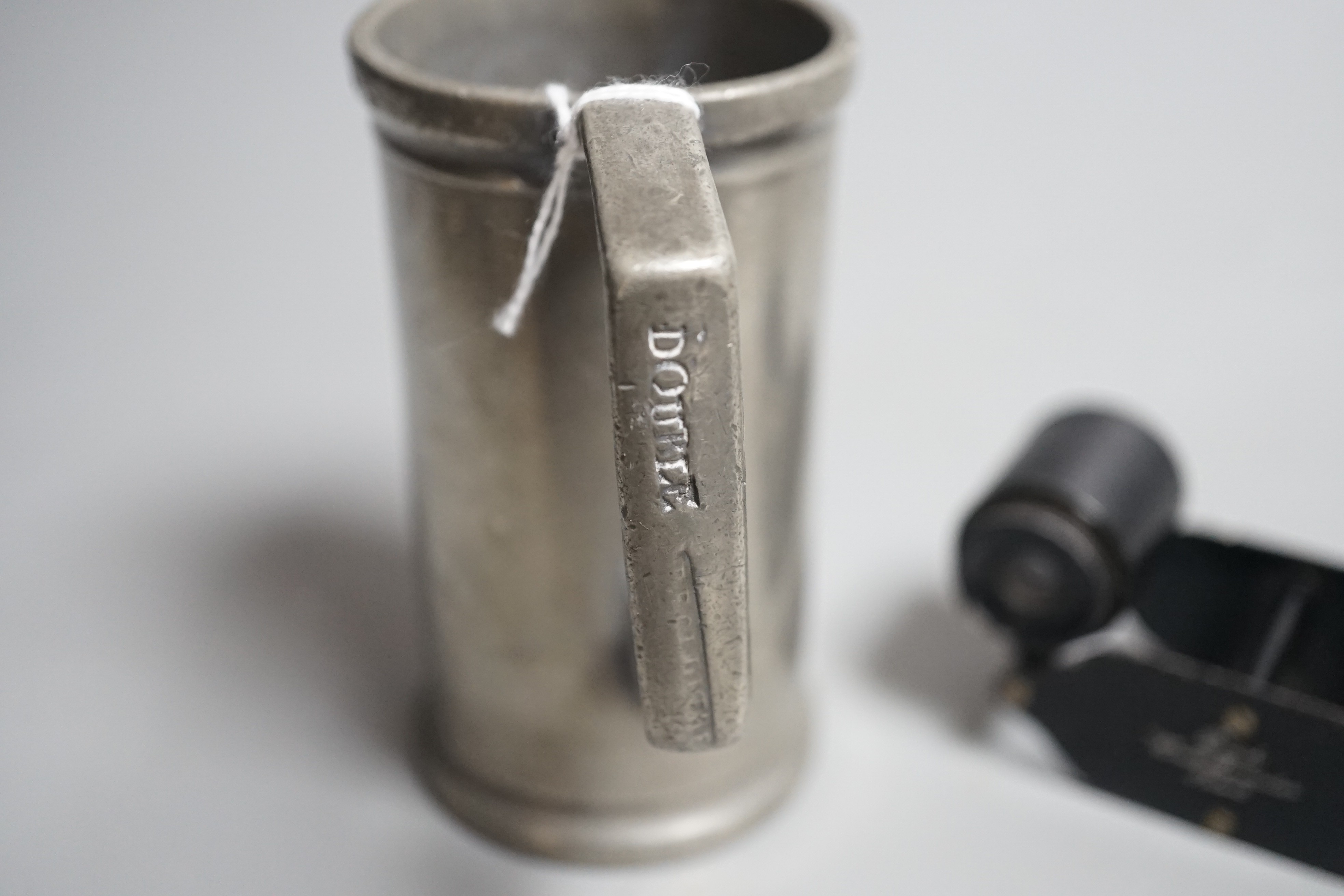 A pair of Busch Winett binoculars in clip case, together with pewter tankard